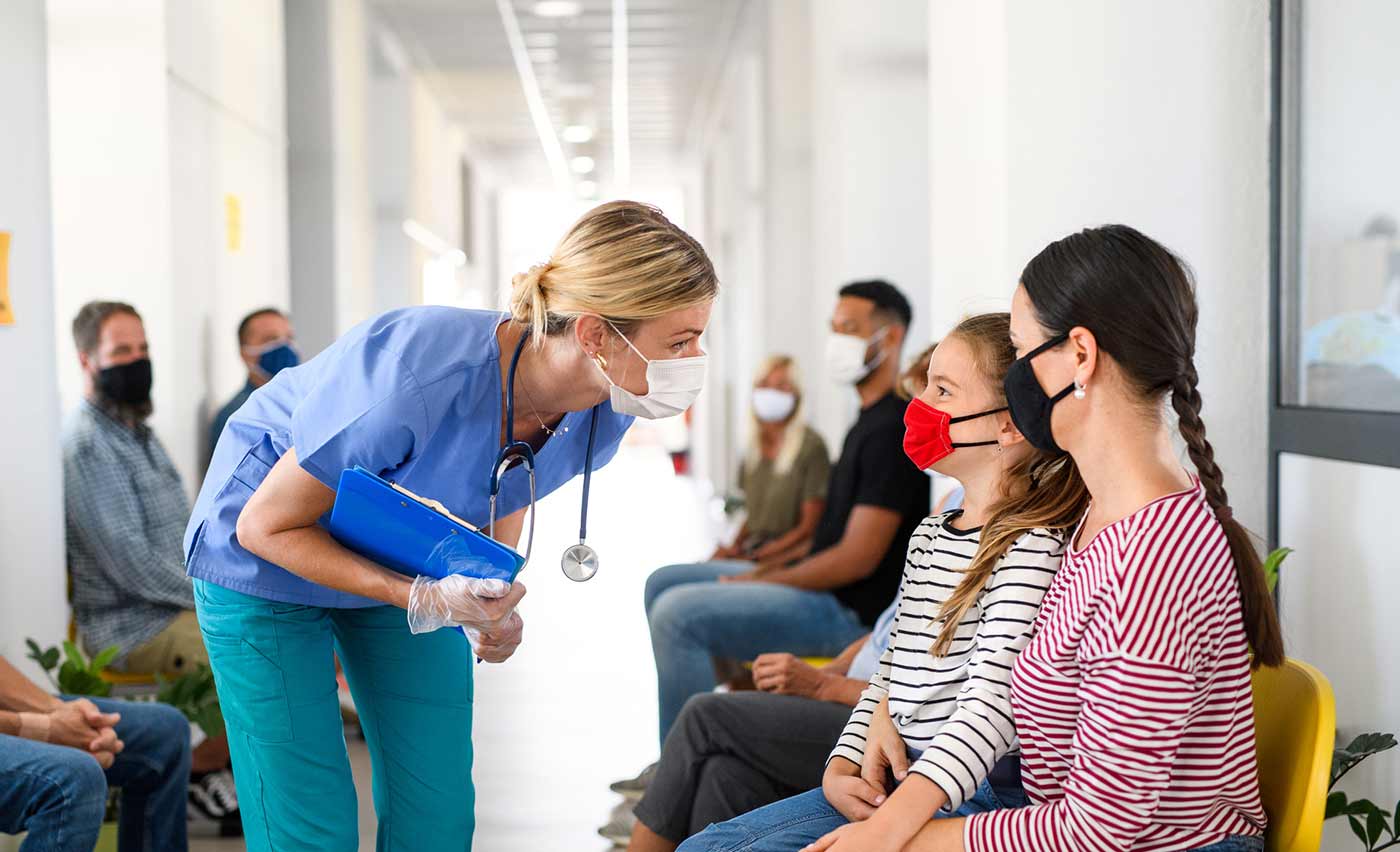 Nurse checking in patient in Emergency Room