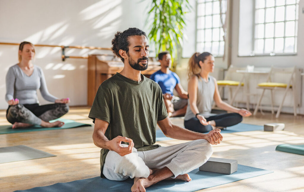 Group of people meditating for stress management