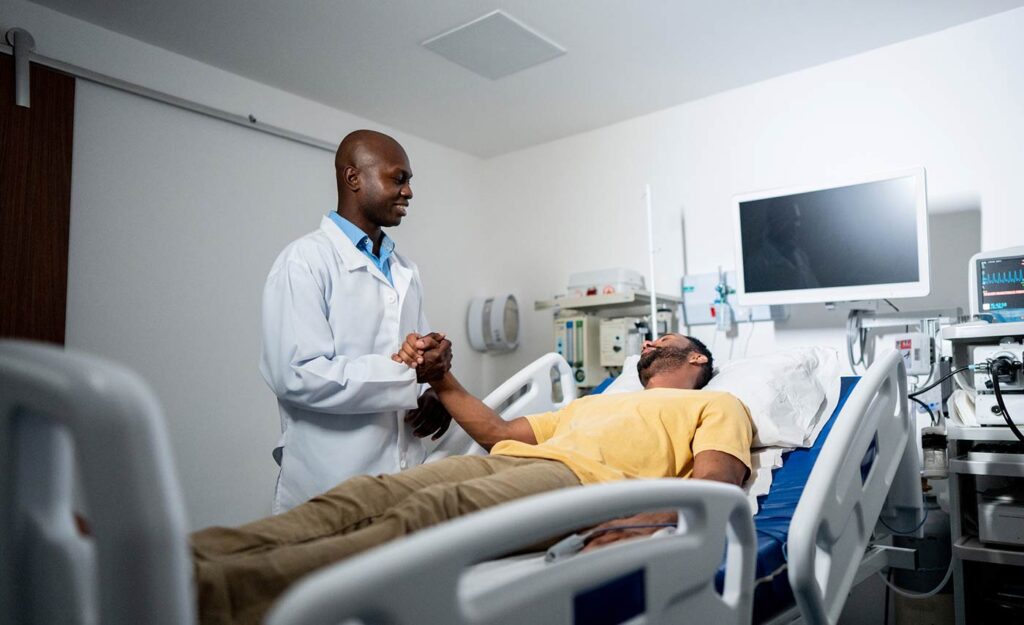 Doctor helping patient in Emergency Room