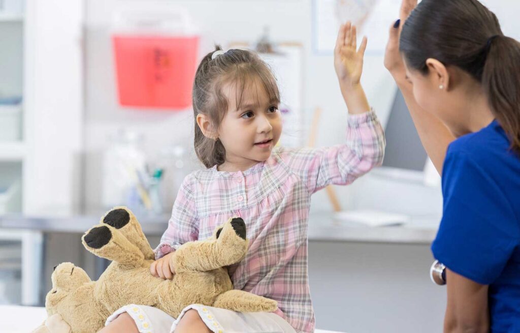 Child with nurse in Emergency Room