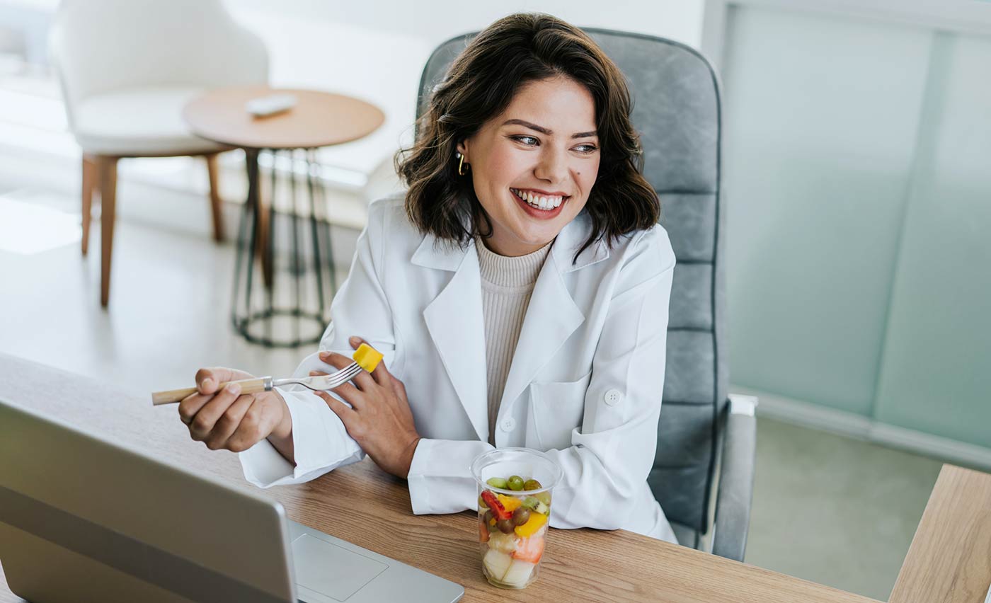 Doctor taking a break to eat a healthy snack.