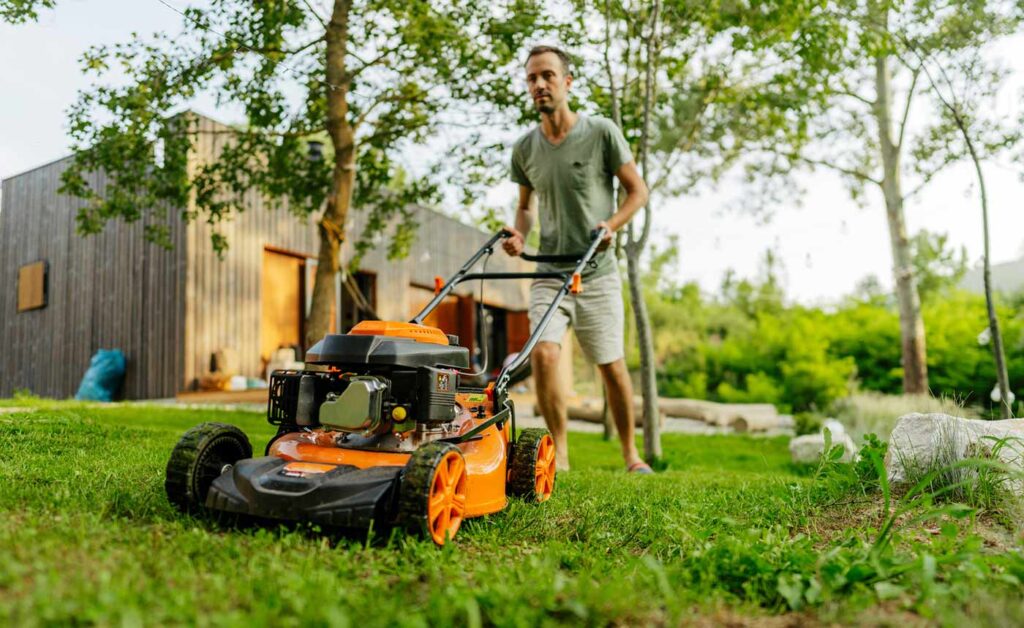 Man mowing his lawn.