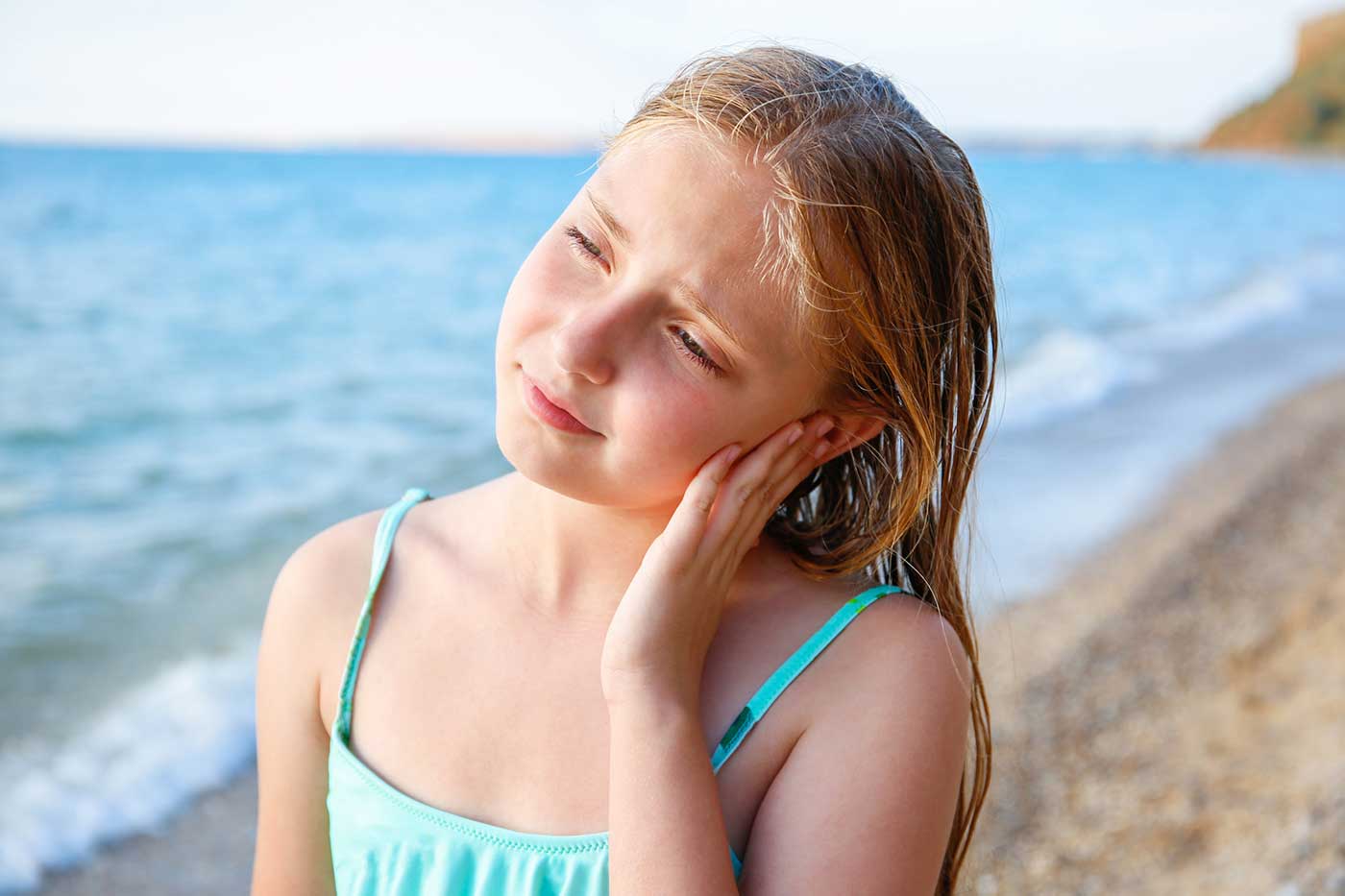 Girl with swimmers ear