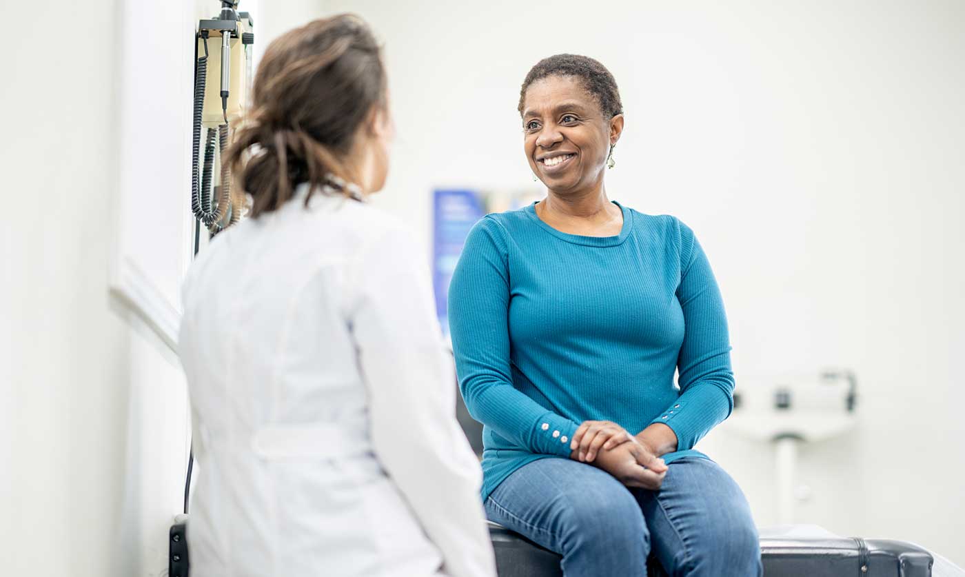 woman consulting with doctor about UTI