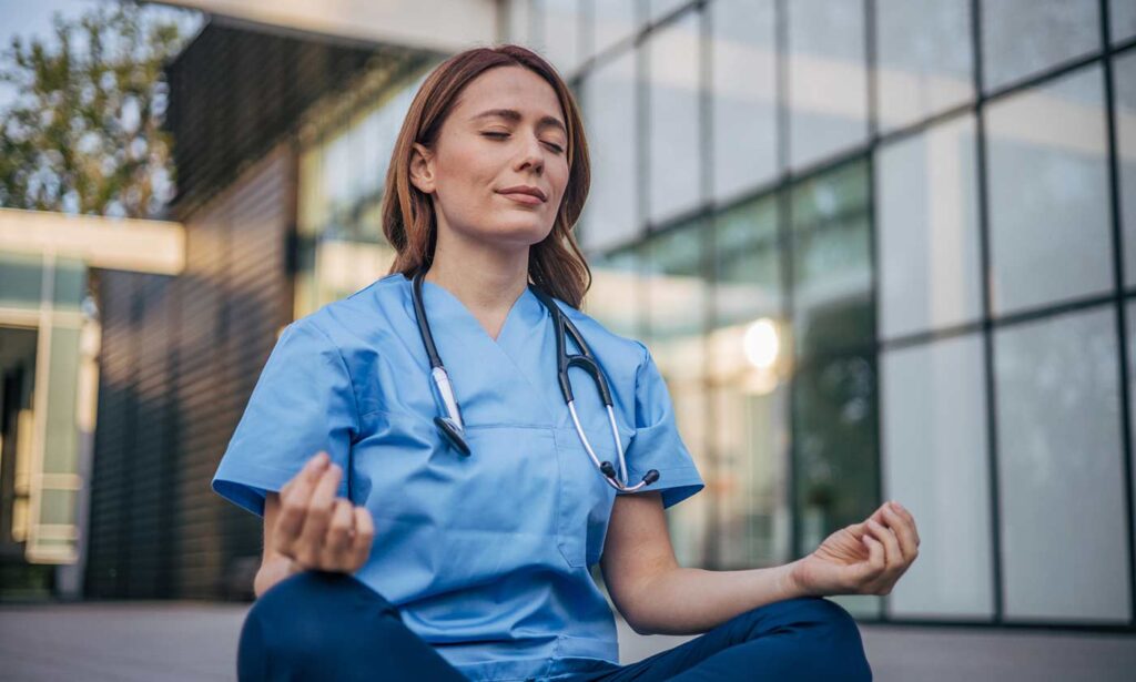 Doctor taking a break to relax with yoga pose